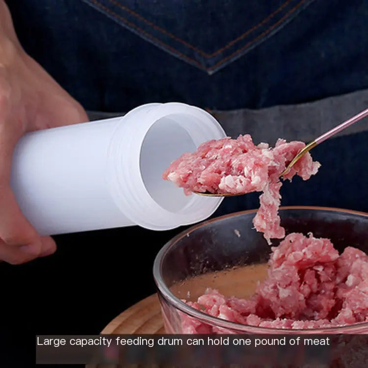 Person using a large capacity feeding drum to add ground meat into a bowl.
